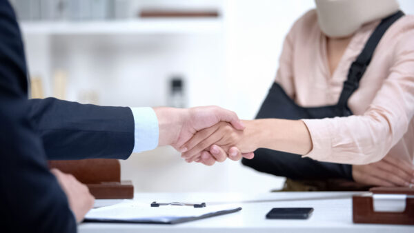 Insurance adjuster evaluating personal injury claim documentation